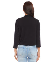 Load image into Gallery viewer, Woman wearing a black long-sleeve cardigan and light blue jeans on a white background.