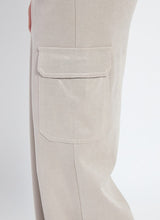 Load image into Gallery viewer, Close-up of cargo pocket on soft taupe shiny pant.