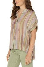 Load image into Gallery viewer, Make a statement in this watercolor printed woven top featuring a hi-low hem! Pastel hues of pinks and greens make this top the perfect addition to your wardrobe. Pairs beautifully with denim or dress it up with a trouser! Looks fabulous paired with our Spanish Moss Liverpool LA jacket. Colors- Watercolor Stripe Print - Pinks, greens, lilac, tan. Short sleeve. Inverted placket. Collared. Button front. Hi-low hem.