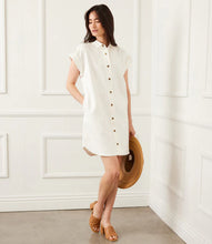 Load image into Gallery viewer, Elevate your wardrobe with the effortlessly chic Celina Cap Sleeve Denim Dress by Karen Kane. Crafted from durable cotton twill denim, this stylish shirtdress features metallic snap closures, cap sleeves, and a flattering relaxed fit—perfect for spring and summer. Designed for versatility, it pairs beautifully with sneakers, sandals, or heels, making it an ideal choice for casual outings or dressed-up occasions.