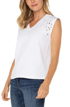 Load image into Gallery viewer, Discover effortless elegance with our Cap Sleeve V-Neck Top by Liverpool Los Angeles. Featuring delicate floral embroidery and a flattering silhouette, this versatile piece is the perfect blend of style and comfort. Pair it with your favorite jeans for a casual outing or elevate your look with tailored trousers for an evening affair. Made from a premium blend of polyester, rayon, and spandex, it’s designed to offer both durability and charm.