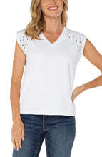 Load image into Gallery viewer, Discover effortless elegance with our Cap Sleeve V-Neck Top by Liverpool Los Angeles. Featuring delicate floral embroidery and a flattering silhouette, this versatile piece is the perfect blend of style and comfort. Pair it with your favorite jeans for a casual outing or elevate your look with tailored trousers for an evening affair. Made from a premium blend of polyester, rayon, and spandex, it’s designed to offer both durability and charm.