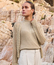 Load image into Gallery viewer, Elevate your wardrobe with the Cira Cardigan Button Lurex by EsQualo. This luxurious gold cardigan features a shimmering lurex fabric, a classic button-front design, and a chic, versatile fit perfect for layering. Whether dressing up or keeping it casual, this stylish knit adds a touch of elegance to any outfit. Shop now for a timeless, fashion-forward look.