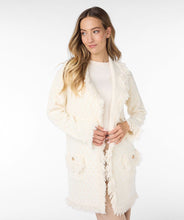 Load image into Gallery viewer, Envelop yourself in the cozy elegance of Esqualo's cardigan, a stunning piece that effortlessly blends style with comfort. The off-white beige hue and delicate fringes lend a touch of bohemian chic to your wardrobe. The beauty is in the details with elevated gold buttons and fringe detailing.