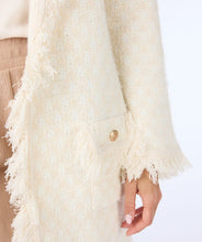 Load image into Gallery viewer, Envelop yourself in the cozy elegance of Esqualo's cardigan, a stunning piece that effortlessly blends style with comfort. The off-white beige hue and delicate fringes lend a touch of bohemian chic to your wardrobe. The beauty is in the details with elevated gold buttons and fringe detailing.