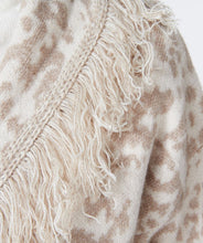 Load image into Gallery viewer, This animal print cardigan with fringe detailing is classic and stylish. The cardigan features a belted waist that adds visual interest. Whether you dress it up or pair it with denim, it's the ideal accessory for cooler weather where a jacket or coat might be too heavy. Color-Bisquit; Light tan and white. Animal print. Belted closure. Fringe detailing all around. Longer design. Fabric - 85% Acrylic. 15% Polyester.
