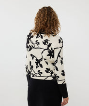Load image into Gallery viewer, Add a touch of sophistication to your wardrobe with our Short Two-Tone Jacquard Cardigan. This stylish cardigan features a unique two-tone jacquard knit in a floral pattern and includes shiny upscale buttons, creating a chic and elegant look. The round neckline and long sleeves provide a classic silhouette, while the ribbing at the neckline, cuffs, and hem adds a polished finish. Perfect for layering over a simple dress or pairing with jeans for a trendy, effortless style.