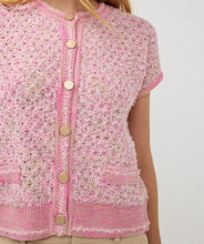 Load image into Gallery viewer, The EsQualo cardigan is a stylish and comfortable option in a delicate pink hue. Its cap sleeves, gold snap buttons, and regular fit make it a versatile choice for layering and adding a touch of sophistication to any outfit. With its soft texture, this cardigan is a must-have for any fashion-forward wardrobe.