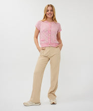 Load image into Gallery viewer, The EsQualo cardigan is a stylish and comfortable option in a delicate pink hue. Its cap sleeves, gold snap buttons, and regular fit make it a versatile choice for layering and adding a touch of sophistication to any outfit. With its soft texture, this cardigan is a must-have for any fashion-forward wardrobe.
