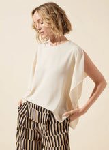 Load image into Gallery viewer, Breezy elegance meets modern versatility in the Carmen "V" Neck Scarf Top by Lysse. Crafted from lightweight Stretch Woven fabric with 2-way stretch, this flowy silhouette is designed to move with you—offering a relaxed fit that flatters without clinging. The unique scarf-inspired construction features two stitched side panels that release at the shoulders, creating graceful drape and dimension with every step.