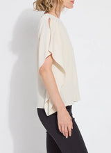 Load image into Gallery viewer, Breezy elegance meets modern versatility in the Carmen "V" Neck Scarf Top by Lysse. Crafted from lightweight Stretch Woven fabric with 2-way stretch, this flowy silhouette is designed to move with you—offering a relaxed fit that flatters without clinging. The unique scarf-inspired construction features two stitched side panels that release at the shoulders, creating graceful drape and dimension with every step.