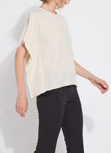 Load image into Gallery viewer, Breezy elegance meets modern versatility in the Carmen "V" Neck Scarf Top by Lysse. Crafted from lightweight Stretch Woven fabric with 2-way stretch, this flowy silhouette is designed to move with you—offering a relaxed fit that flatters without clinging. The unique scarf-inspired construction features two stitched side panels that release at the shoulders, creating graceful drape and dimension with every step.