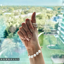 Load image into Gallery viewer, Perfect for any wrist, this timeless bracelet showcases an adjustable design embellished with freshwater pearls. A versatile piece suitable for any occasion.