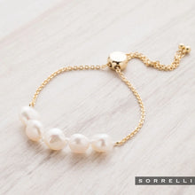 Load image into Gallery viewer, Perfect for any wrist, this timeless bracelet showcases an adjustable design embellished with freshwater pearls. A versatile piece suitable for any occasion.