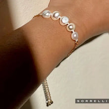 Load image into Gallery viewer, Perfect for any wrist, this timeless bracelet showcases an adjustable design embellished with freshwater pearls. A versatile piece suitable for any occasion.