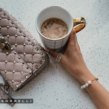 Load image into Gallery viewer, Perfect for any wrist, this timeless bracelet showcases an adjustable design embellished with freshwater pearls. A versatile piece suitable for any occasion.