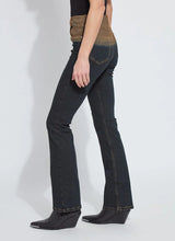 Load image into Gallery viewer, Person wearing a pair of jeans with a gradient color from brown to black, black top and black boots against a white background.