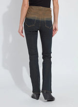 Load image into Gallery viewer, Person wearing a pair of jeans with a gradient color from brown to black, black top and black boots against a white background.