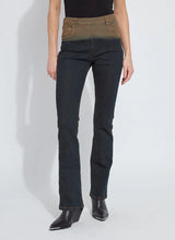 Load image into Gallery viewer, Person wearing a pair of jeans with a gradient color from brown to black, black top and black boots against a white background.