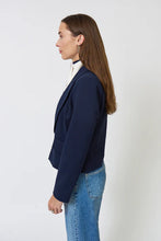 Load image into Gallery viewer, Woman wearing a navy blazer with a striped dickey and blue jeans against a plain background.