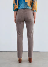 Load image into Gallery viewer, Person wearing taupe pants with a colorful top and tan boots against a white background.