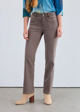 Load image into Gallery viewer, Person wearing taupe pants, a colorful top and tan boots against a white background.