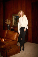 Load image into Gallery viewer, Dazzle and glisten in our Cybele Classic Denim Pencil Skirt with Rhinestones designed by Joseph Ribkoff. Elevate your daily attire with this iconic denim skirt, showcasing a captivating front slit, 5-pocket design, and intricate all-over sparkling embellishments.