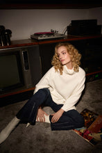 Load image into Gallery viewer, Effortlessly elevate any ensemble with these timeless Cosima Classic Flared Denim Pants by Joseph Ribkoff. These fabulous denim pants feature dazzling rhinestone rivets along the front leg. Perfect for both casual outings and nights on the town, these enduring pants add an edgy touch and versatile flair.