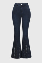 Load image into Gallery viewer, Effortlessly elevate any ensemble with these timeless Cosima Classic Flared Denim Pants by Joseph Ribkoff. These fabulous denim pants feature dazzling rhinestone rivets along the front leg. Perfect for both casual outings and nights on the town, these enduring pants add an edgy touch and versatile flair.
