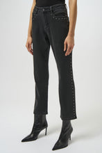 Load image into Gallery viewer, Model wearing dark grey studded jeans and black high heeled boots against a white background.