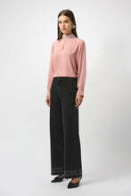 Load image into Gallery viewer, Woman wearing a pink blouse, dark grey denim jeans and heels against a white background.