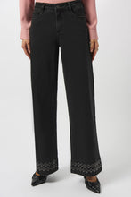 Load image into Gallery viewer, Woman wearing a pink blouse, dark grey denim jeans and heels against a white background.