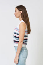Load image into Gallery viewer, Woman wearing a sleeveless blue and multi stripe top and blue jeans against a white background.
