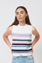 Load image into Gallery viewer, Woman wearing a sleeveless blue and multi stripe top and blue jeans against a white background.