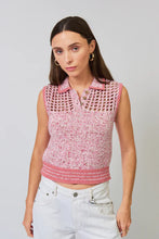 Load image into Gallery viewer, Woman wearing a sleeveless pink crop polo top and white pants against a grey background.