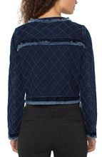 Load image into Gallery viewer, Model wearing a navy quilted jacket with velvet and fray hem and black pants on a white background.