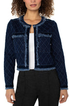 Load image into Gallery viewer, Woman wearing a navy quilted finish jacket with fray and velvet detailing over a white top and black pants on a white background.