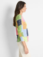 Load image into Gallery viewer, Designers went above and beyond with our Gail sweater, expanding and improving the check pattern to produce a unique vibrant color block design. The silhouette is pull-on and features a round neckline and 3/4 length sleeves with a charming cut at the cuff for added detail. Comfortable all day long, it can be worn as a top, a layer, or under a blazer or jacket.