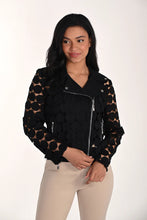 Load image into Gallery viewer, Woman wearing a modern black dot jacket over a black tank and tan pants against a white background.
