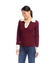 Load image into Gallery viewer, Woman wearing a burgundy sweater with a white collar and jeans against a white background.