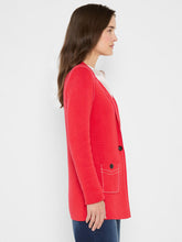 Load image into Gallery viewer, Woman wearing a red blazer and jeans against a white background.