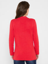 Load image into Gallery viewer, Woman wearing a red blazer and blue jeans against a white background.