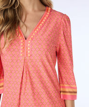 Load image into Gallery viewer, This timeless dress is a customer favorite. This season it is offered in a gorgeous coral color with timeless chain print and cute beading along the v-neckline. The dress is approximately knee length and has a three-quarter length sleeve.