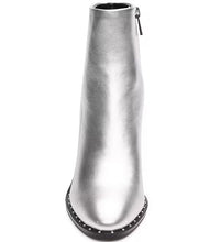 Load image into Gallery viewer, Make a fashion statement with these round-toe ankle boots. Adorned with a dazzling silver metallic color, studded detailing, and a robust stiletto heel, these boots add a dash of urban elegance and individual flair to any outfit.