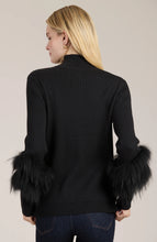 Load image into Gallery viewer, Elevate your turtleneck with a hint of faux fur that rivals the appearance of real fur. This distinctive touch transforms a basic item into a versatile piece suitable for any event, whether during the day or at night. Dress up with a skirt or trouser or show off a modern, casual vibe with your favorite denim.