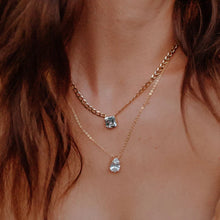 Load image into Gallery viewer, his gorgeous Country Club Necklace is a stunner and certainly will add extra shine to your everyday outfit! A sparkling pear shape cubic zirconia hangs from a dainty gold chain. A perfect necklace to wear alone or layer with your other favorite pieces. Colors- Gold and clear. Cubic zirconia. 14 kt gold plating over brass. Measures 17 inches with a 2" extender.