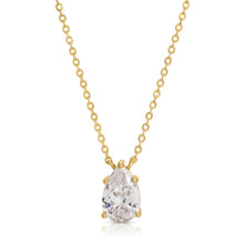Load image into Gallery viewer, his gorgeous Country Club Necklace is a stunner and certainly will add extra shine to your everyday outfit! A sparkling pear shape cubic zirconia hangs from a dainty gold chain. A perfect necklace to wear alone or layer with your other favorite pieces. Colors- Gold and clear. Cubic zirconia. 14 kt gold plating over brass. Measures 17 inches with a 2" extender.
