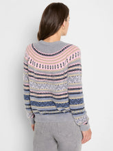 Load image into Gallery viewer, Woman wearing a pink and grey multi fairisle sweater and grey pants against a white wall.
