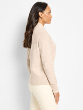 Load image into Gallery viewer, Woman wearing a beige sweater and white pants against a white background.