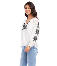 Load image into Gallery viewer, Effortlessly stylish, the Karen Kane Charlee Cream and Black Embroidered Peasant Top offers a timeless blend of charm and comfort. Crafted from lightweight cotton for a breathable, breezy feel, this top features intricate floral embroidery and a flattering split neckline. The voluminous blouson sleeves add a touch of elegance, making it versatile enough for casual days or polished evenings.